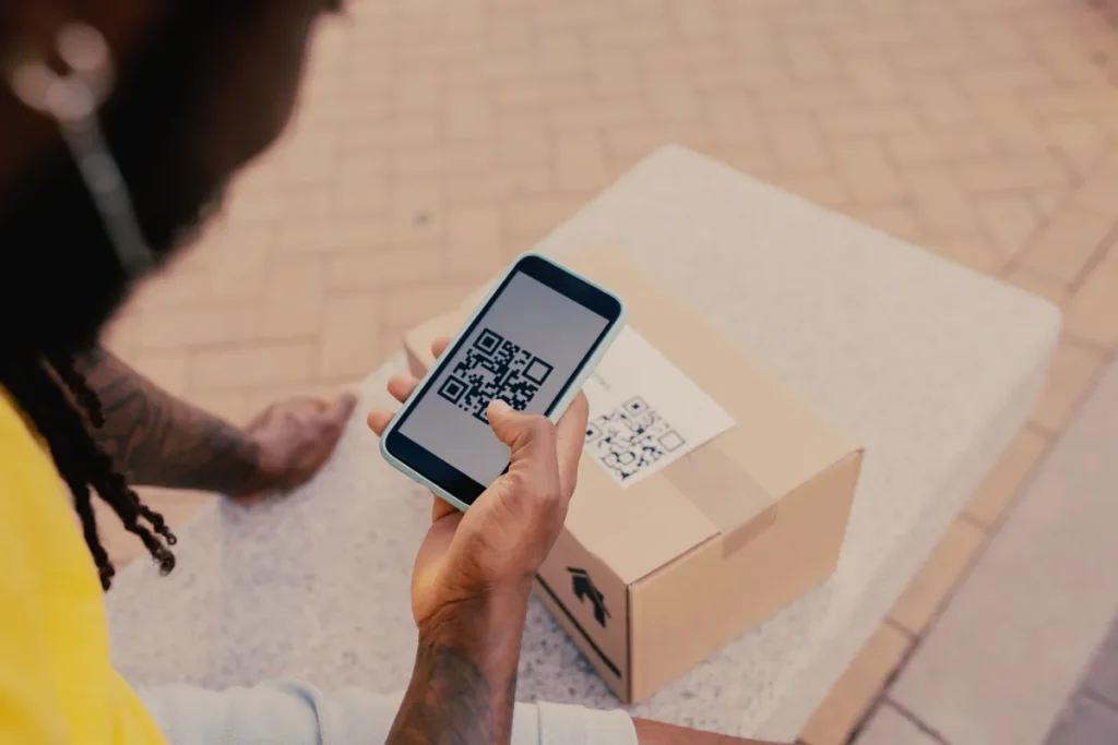 Smartphone scanning a QR code on a sustainable package, demonstrating smart packaging technology